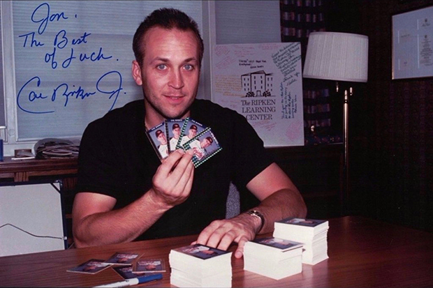 Cal Ripken Jr. hard at work signing 5000 copies of the 1992 Donruss Elite card.